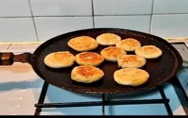 Opputtu cooking on a flat griddle